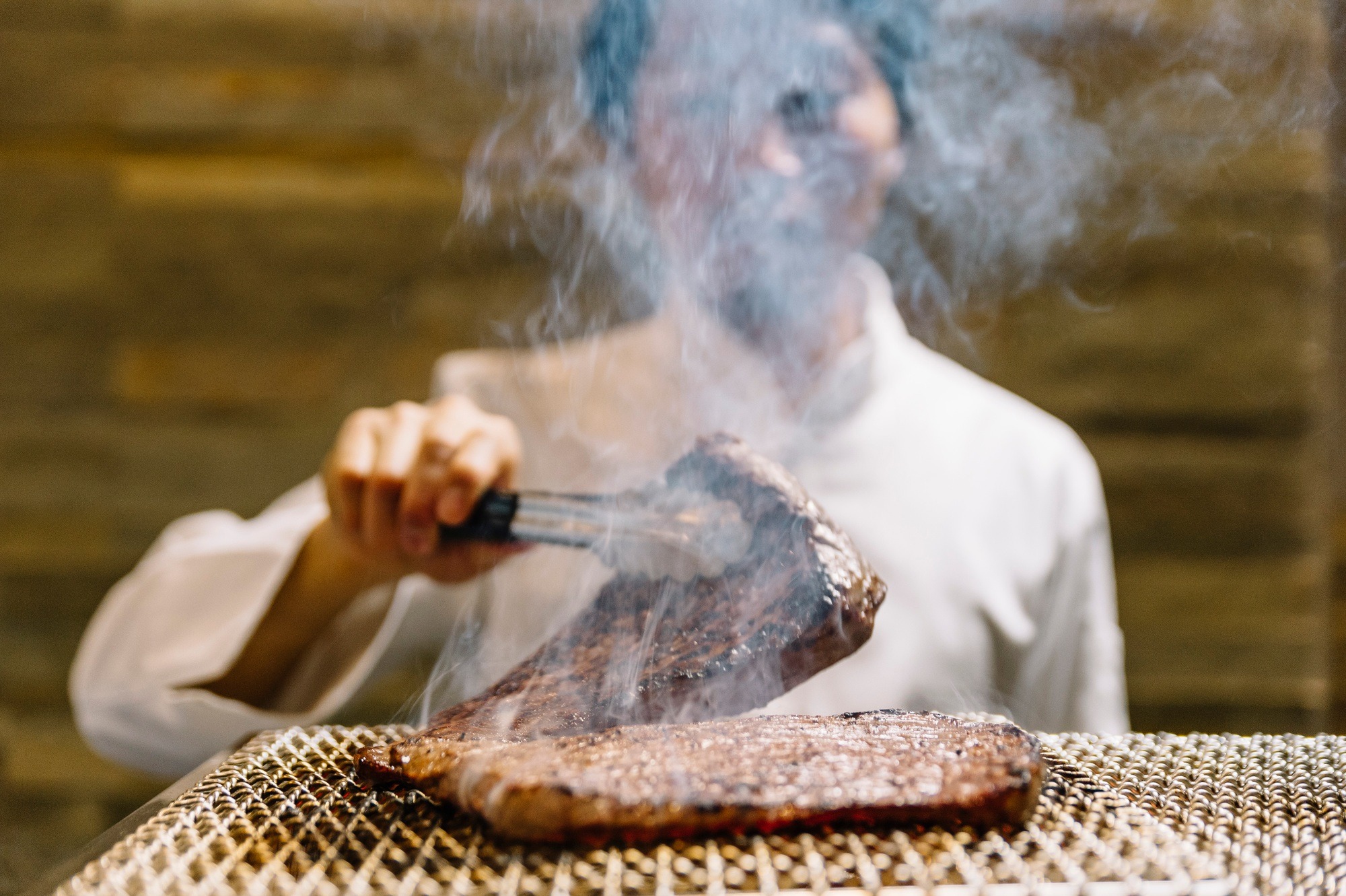 Chef cooking in restaurant preparing beef roast